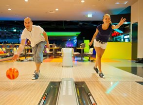 Man and woman at bowling alley.