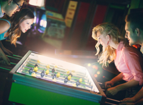 Two couples playing football game.