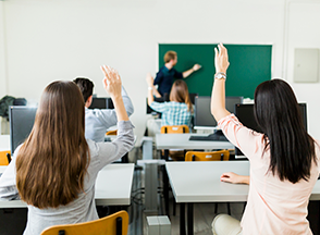 Students and Teacher in a classroom.