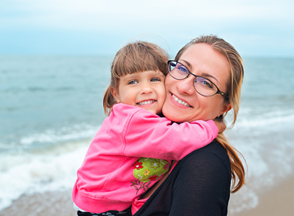 mother holding daughter
