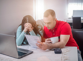 couple looking at bills