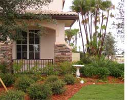 front of house with bushes