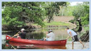 two men canoeing