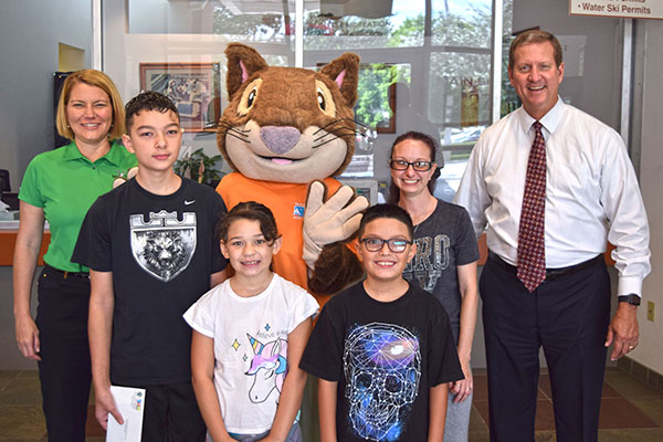 kids smiling with mascot