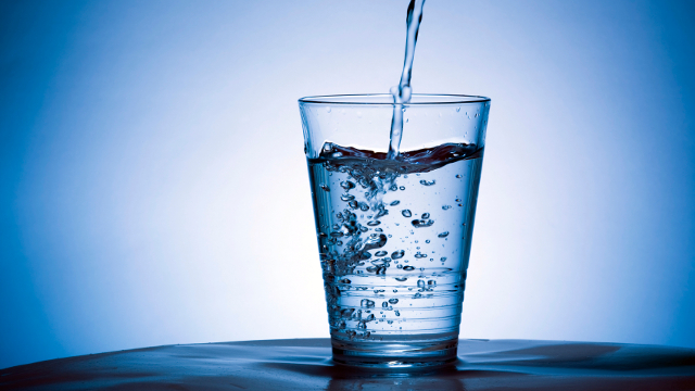 glass of water with blue background